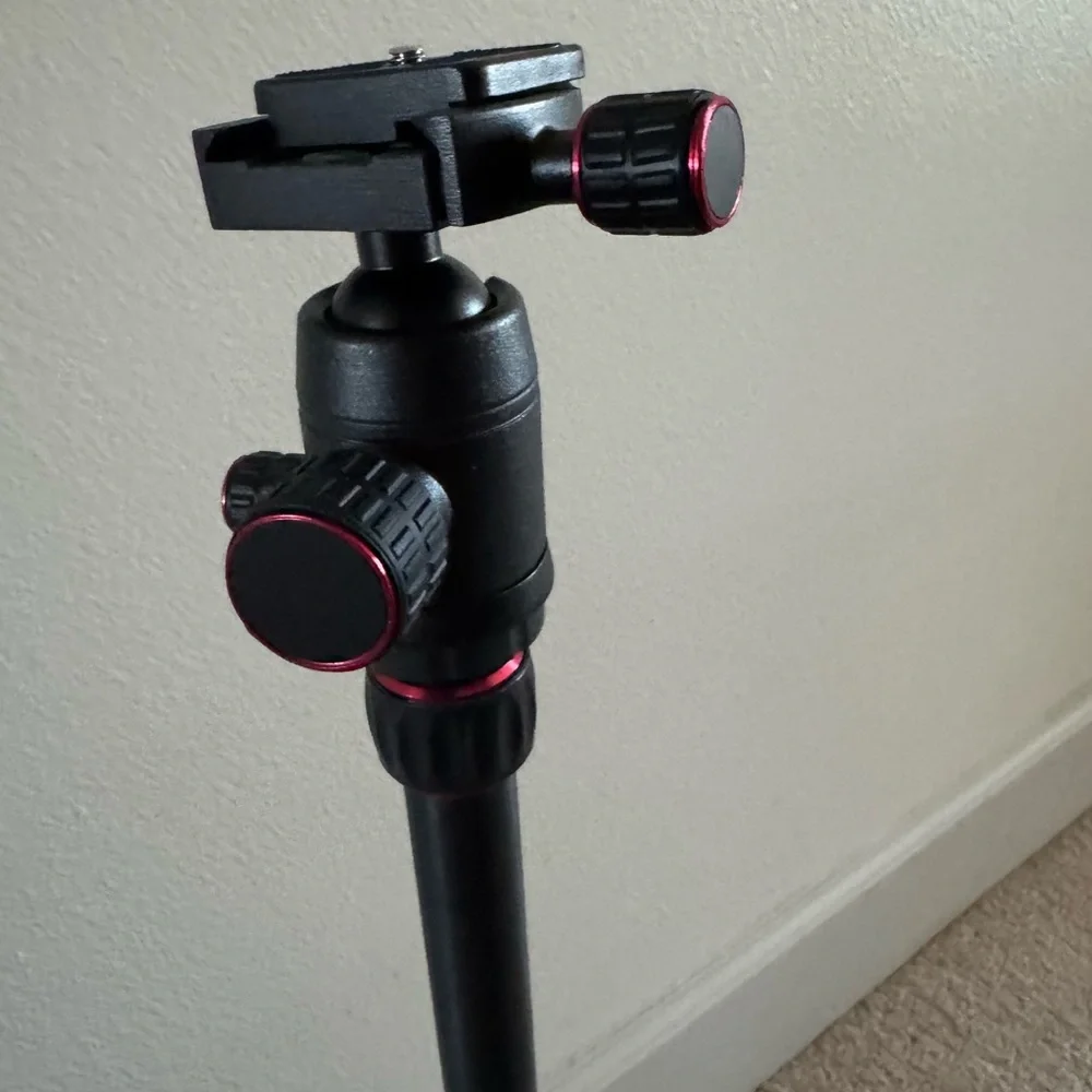 Compact Black Tripod with Red Accents